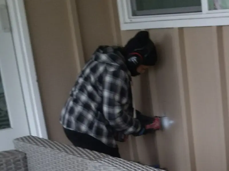 Professional electrician installing an exterior outlet in Scappoose